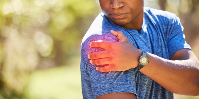 Hand, shoulder and pain with a sports black man holding his joint after injury during his fitness. Shoulder Pain Treatment London | Shoulder Clinic London